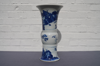 Een Chinese blauw-witte gu vaas met landschapsdecor, Kangxi merk en periode