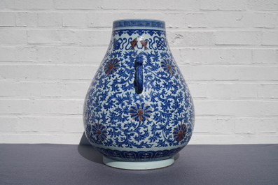 A Chinese blue, white and copper red 'hu' vase, Qianlong mark, 19/20th C.