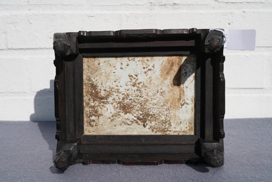 A Chinese carved wooden stand with famille rose plaque, 19th C.