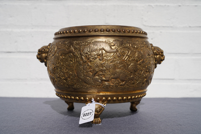 A Chinese gilt bronze tripod censer with buddhist lions, Qianlong mark, 19/20th C.