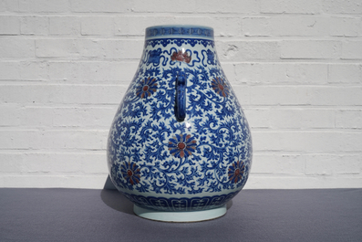 A Chinese blue, white and copper red 'hu' vase, Qianlong mark, 19/20th C.