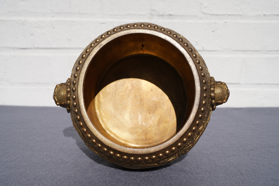 A Chinese gilt bronze tripod censer with buddhist lions, Qianlong mark, 19/20th C.