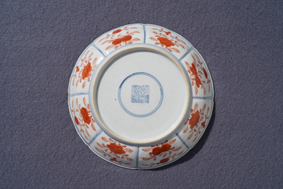 A Chinese blue, white and iron red 'Buddhist lion' plate, Qianlong mark, 18/19th C.