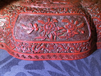 A Chinese cinnabar lacquer box and cover with figures in a landscape, 19th C.