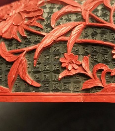 A Chinese cinnabar lacquer box and cover with figures in a landscape, 19th C.