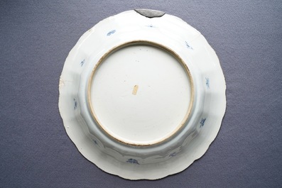 Two Chinese blue and white gadrooned 'crabs and carps' dishes and a pair of plates, Kangxi