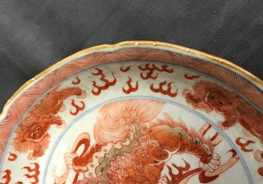 A Chinese blue, white and iron red 'Buddhist lion' plate, Qianlong mark, 18/19th C.