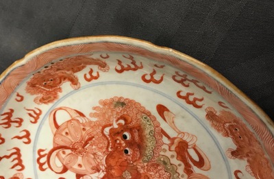 A Chinese blue, white and iron red 'Buddhist lion' plate, Qianlong mark, 18/19th C.