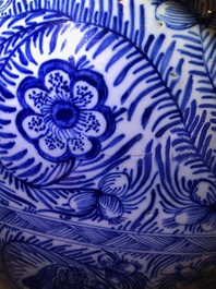 A pair of large Dutch Delft blue and white vases and covers, 18th C.