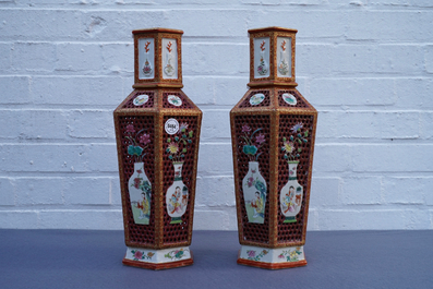 A pair of Chinese reticulated double-walled hexagonal famille rose vases, Yongzheng