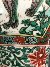 A Chinese wucai &lsquo;mythical beasts&rsquo; vase and cover, Transitional period