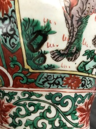 A Chinese wucai &lsquo;mythical beasts&rsquo; vase and cover, Transitional period