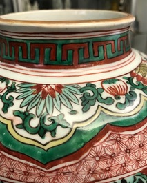 A Chinese wucai &lsquo;mythical beasts&rsquo; vase and cover, Transitional period