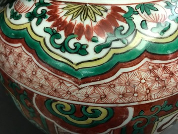 A Chinese wucai &lsquo;mythical beasts&rsquo; vase and cover, Transitional period