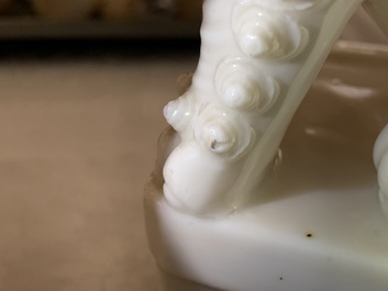 A pair of large Chinese Dehua blanc de Chine buddhist lion joss stick holders, Kangxi