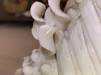 A pair of large Chinese Dehua blanc de Chine buddhist lion joss stick holders, Kangxi