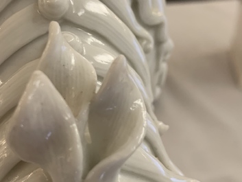 A pair of large Chinese Dehua blanc de Chine buddhist lion joss stick holders, Kangxi