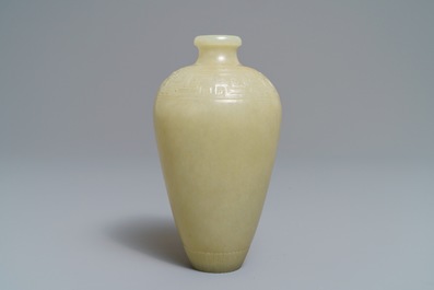 A Chinese light celadon jade relief-decorated meiping vase, 19/20th C.