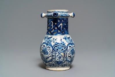 A Dutch Delft blue and white puzzle jug, dated 1737