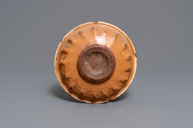 An Italian earthenware sgraffiato armorial dish, prob. Ferrara, 15/16th C.
