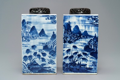 A pair of tall Chinese blue and white tea caddies with landscapes, 19th C.