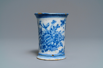 An extremely rare inscribed Dutch Delft blue and white beaker after a silver example, dated 1676