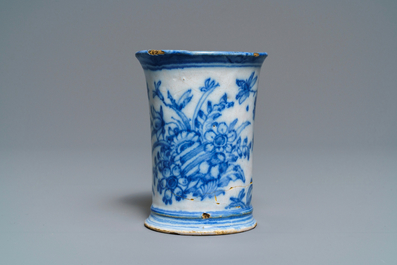 An extremely rare inscribed Dutch Delft blue and white beaker after a silver example, dated 1676