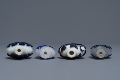 Nine various Chinese blue overlay and transparent glass snuff bottles, 19/20th C.
