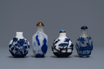 Nine various Chinese blue overlay and transparent glass snuff bottles, 19/20th C.