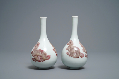 A pair of Chinese copper red 'mythical beasts' vases, Kangxi