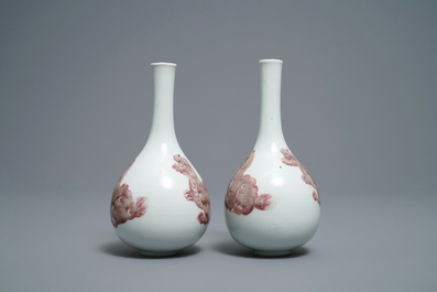 A pair of Chinese copper red 'mythical beasts' vases, Kangxi