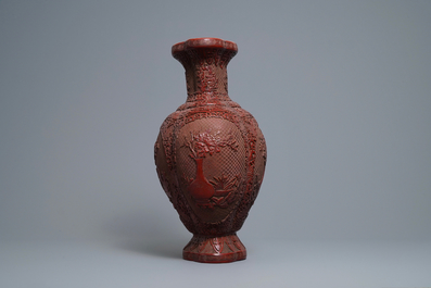 A Chinese carved cinnabar lacquer vase, Qianlong mark, 19/20th C.