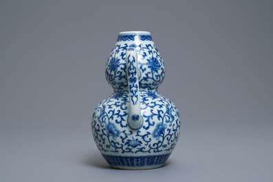 A Chinese blue and white 'bats and shou' jug, 19th C.