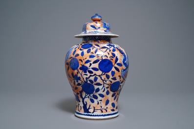 A Chinese blue and white clobbered 'qilin and phoenix' vase and cover, 19th C.