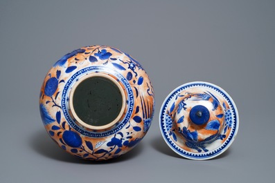 A Chinese blue and white clobbered 'qilin and phoenix' vase and cover, 19th C.