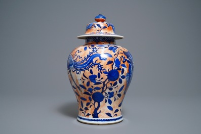 A Chinese blue and white clobbered 'qilin and phoenix' vase and cover, 19th C.