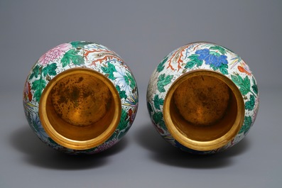 A pair of large bronze-mounted Chinese famille rose vases, 19th C.
