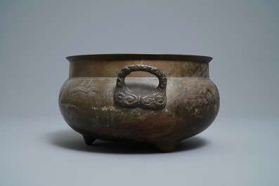 A large Chinese bronze tripod censer with engraved dragons, 19th C.