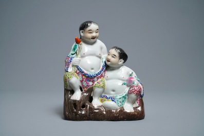 A Chinese famille rose 'two boys' group, impressed seal marks, Republic