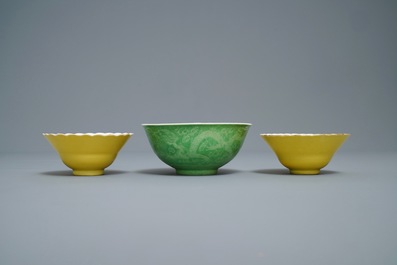 A pair of Chinese monochrome yellow bowls and a lime-green dragon bowl, Guangxu marks, 19/20th C.