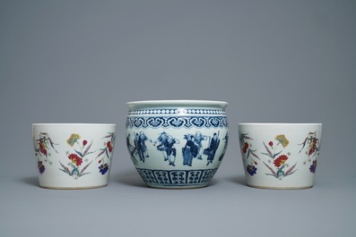 A pair of Chinese famille rose jardini&egrave;res and a blue and white example, 19th C.