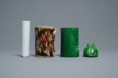 Two Chinese monochrome relief-decorated brush pots, an incense tube and a rabbit, 18/19th C.