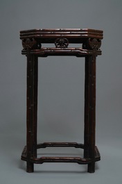A Chinese huali wooden stand with famille rose plaque, Jiaqing
