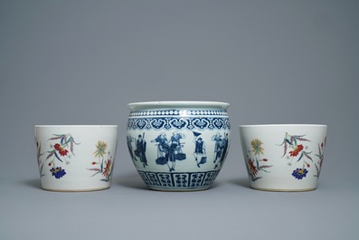 A pair of Chinese famille rose jardini&egrave;res and a blue and white example, 19th C.