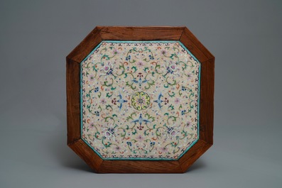A Chinese huali wooden stand with famille rose plaque, Jiaqing