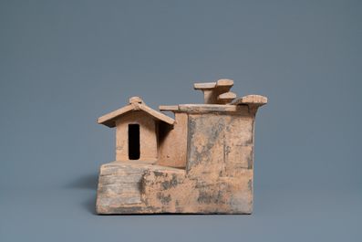 A Chinese earthenware model of a stable and five animals, Han