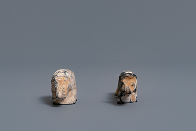 A Chinese earthenware model of a stable and five animals, Han