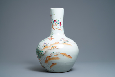 A Chinese famille rose 'peaches' vase, Qianlong mark, 19th C.