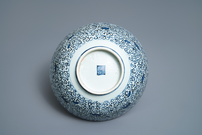 A Chinese blue and white bowl with a qilin and flower scrolls, Wanli