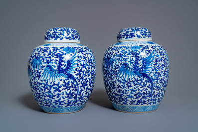 A pair of Chinese blue and white covered 'phoenix' jars, Kangi mark, 19th C.